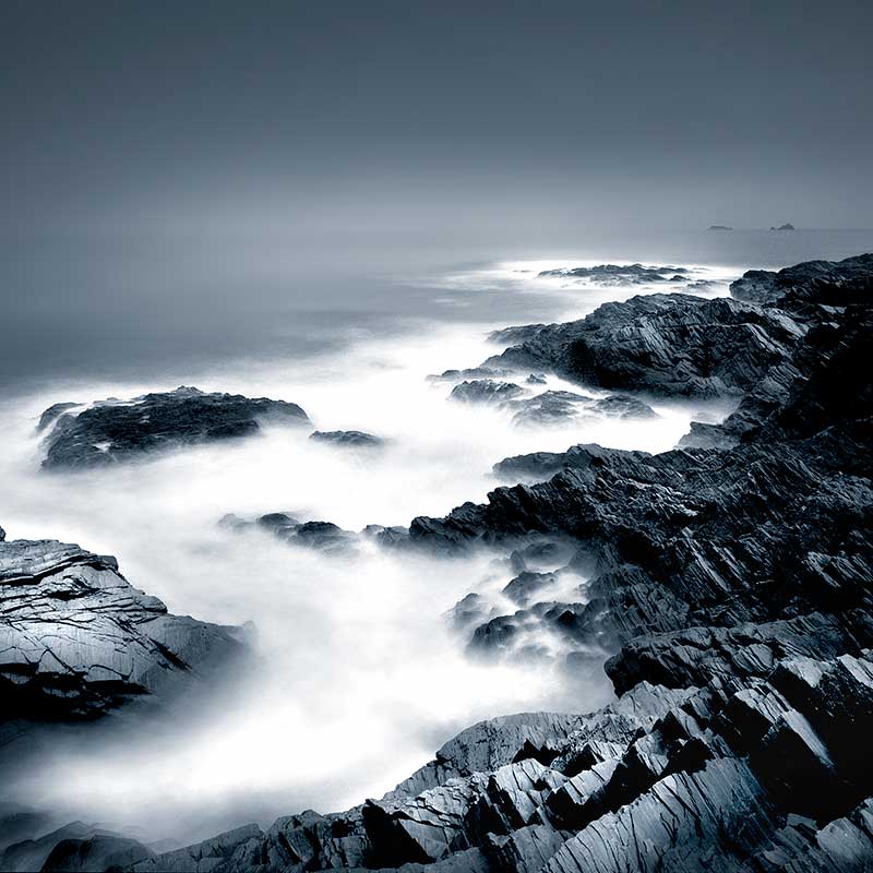 Waves hitting a shore with a long exposure