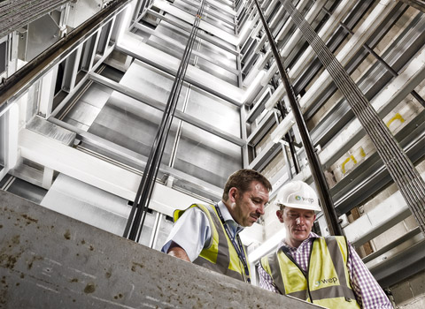 Workers in a lift shaft
