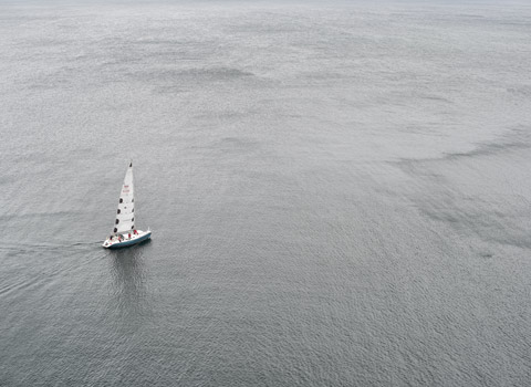 A yacht sailing in the sea of The Isle of Skye
