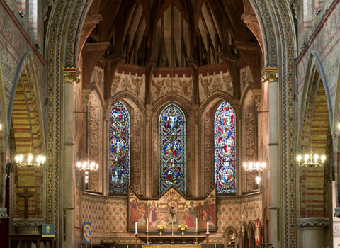 Church interior with stained glass windows in Kent