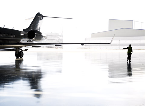 Airplane leaving a hanger at Standstead airport