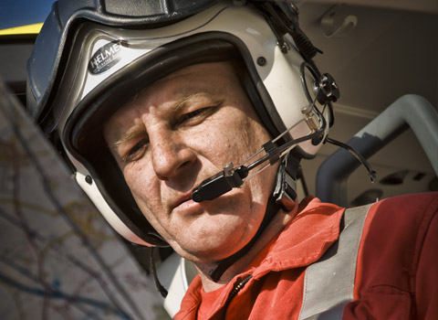 Image of crew member reading a map