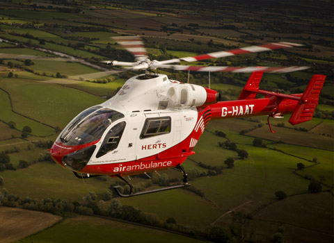 Helicopter flying over countryside