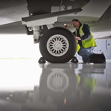 Aircraft maintenance being carried out in a fixed base operation at Stansted airport