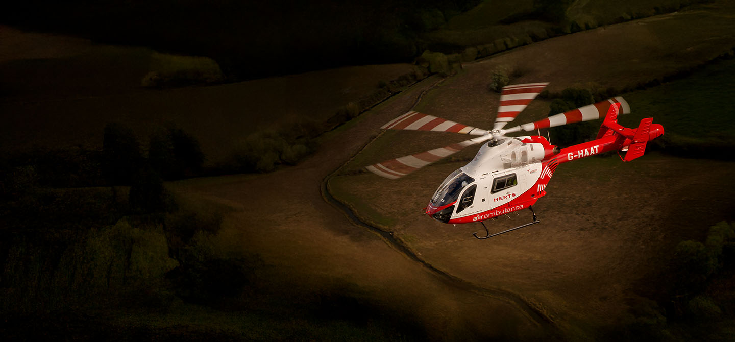 A helicopter photographed from above while flying over the Essex countryside