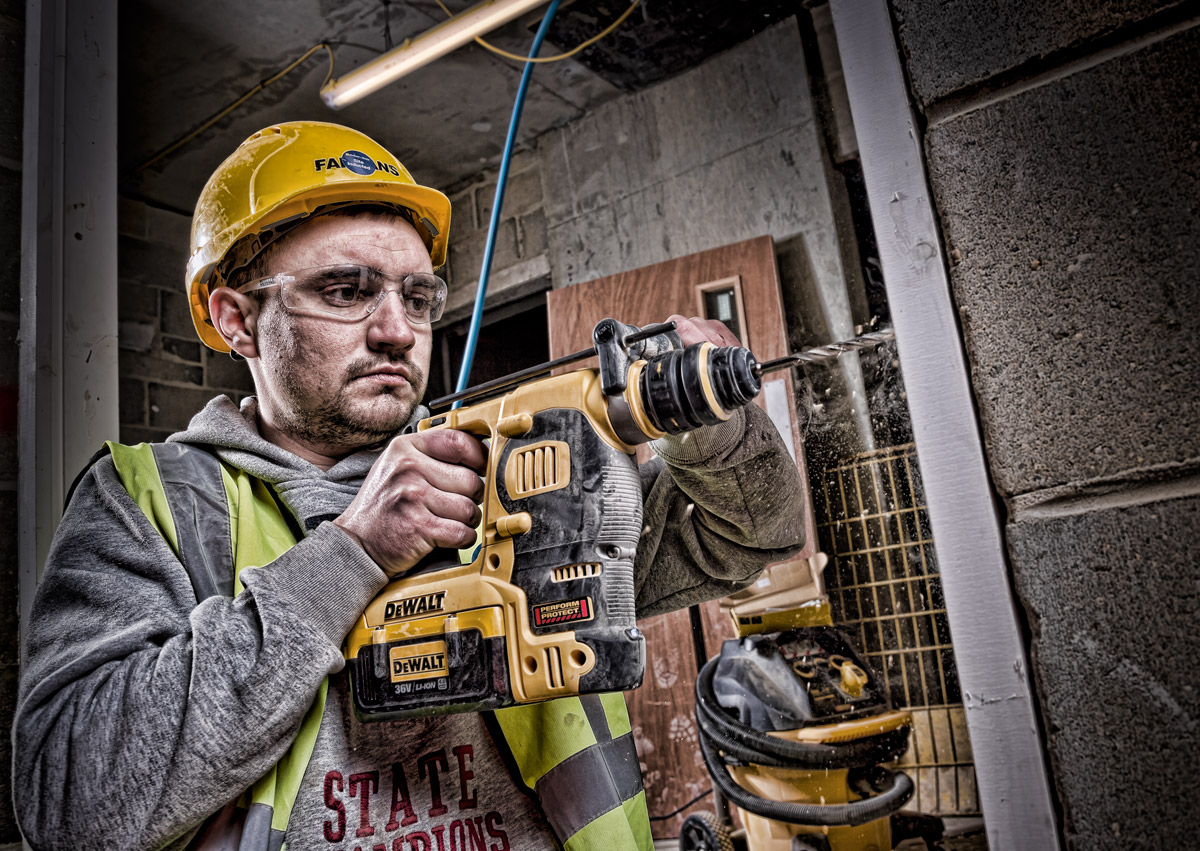Worker using a drill