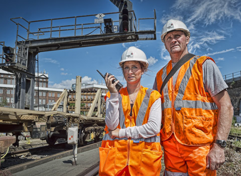 Railway workers photographed on the tracks