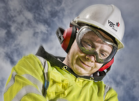 Worker using a pneumatic drill for a campaign to promote the reduction in cases of white finger