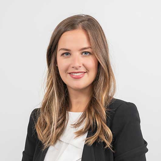 Woman photographed against a plain background