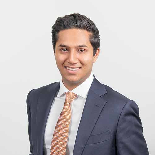 Portrait of a man against a plain background photographed in the companies central London office