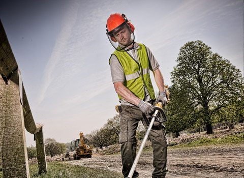 Using a deWalt strimmer on a large landscape project