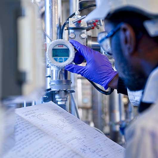 Engineering student checking a guage at a central London education facility.