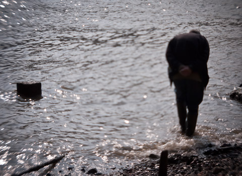 Beachcomber walking into The Thames