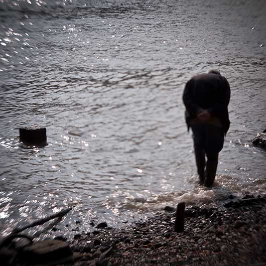 Beachcomber walking in the Thames