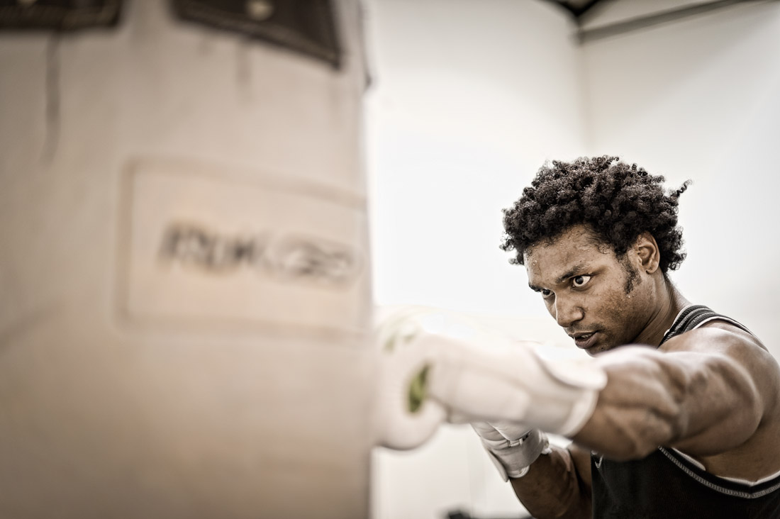 Boxer hitting a punch bag