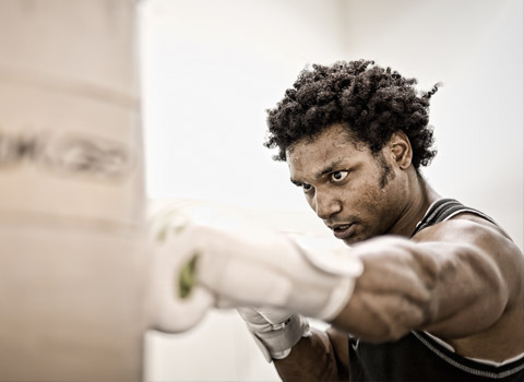 Boxer hitting a punch bag