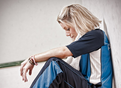 Portrait of a young woman in a gym after a work out