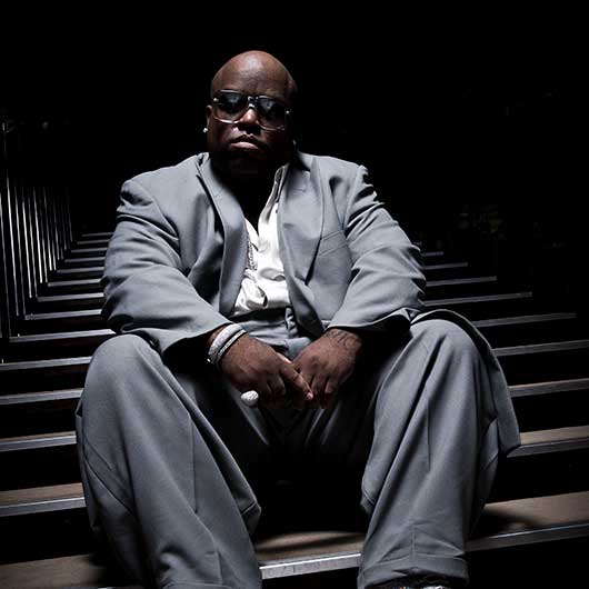 Creative portrait of a singer sitting on steps with imaginative lighting