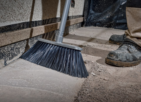 Broom being used on a construction site