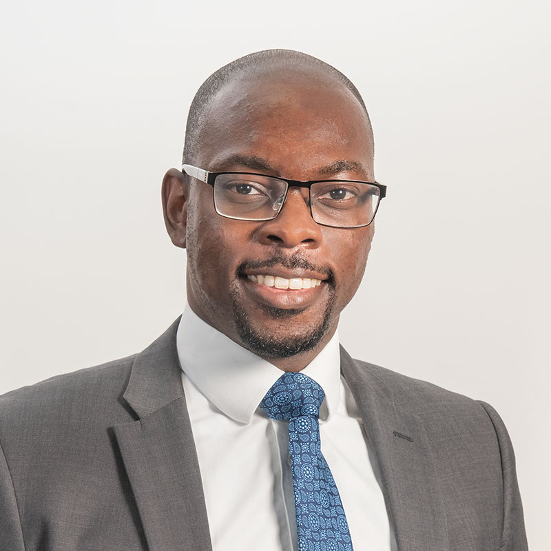 Professional portrait photographed in an office during a shoot with a specialist corporate photographer. The subject looks relaxed, professional and confident.