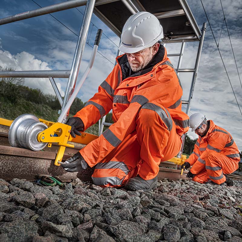 Workers in orange hi-viz on a railway