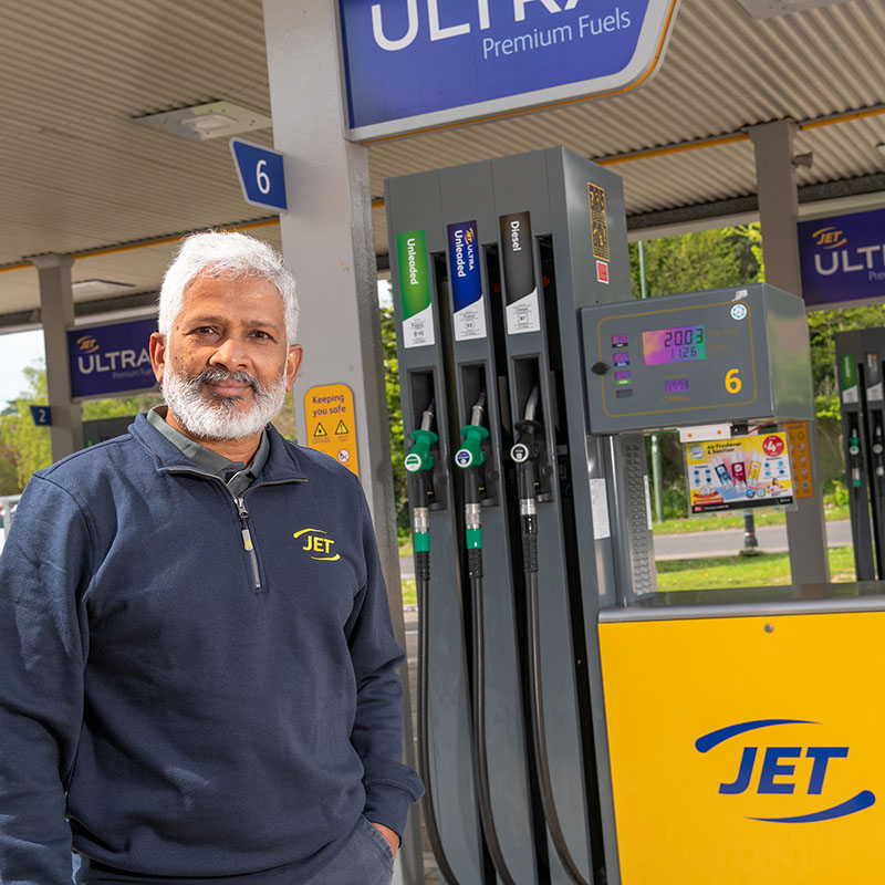 Owner of a petrol station beside the petrol pumps